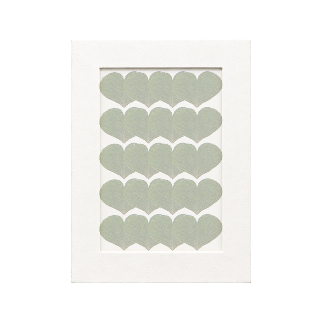 20 pressed Wood Sorrel Leaflets pieces beneath translucent tracing paper